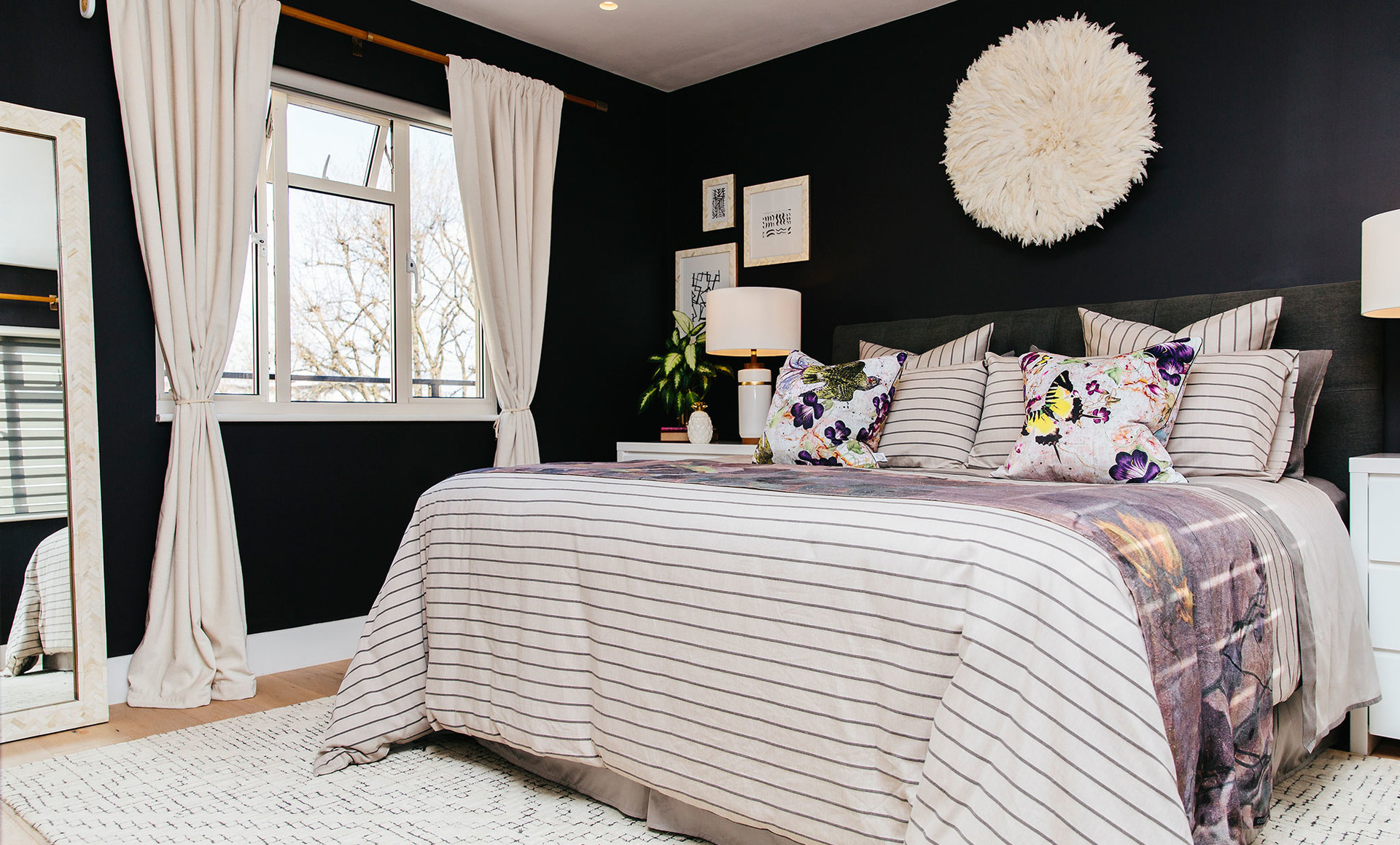 A bold yet elegant master bedroom with accents of purple Mybespokeroom