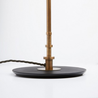 Elona floor lamp in brass with a black iron base