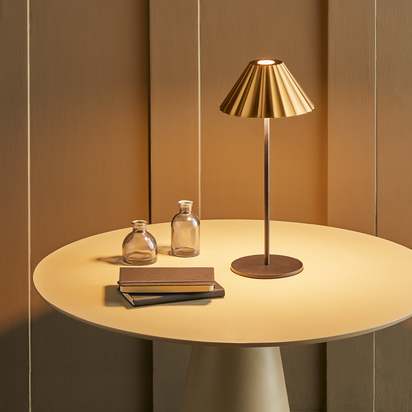 Twinky rechargeable table lamp in black with a brass hood