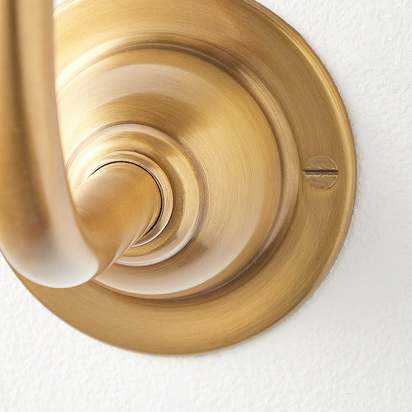 Minnow wall fitting in antique brass