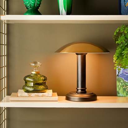 Hernan rechargeable table lamp with an antiqued brass and bronze finish