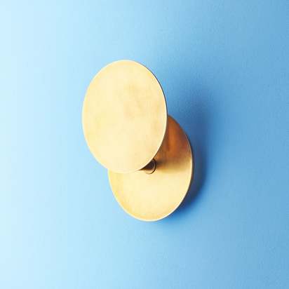 Franz wall light in aged brass finish