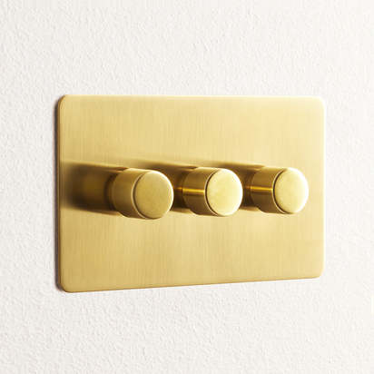 Lucian three gang dimmer switch in top brass