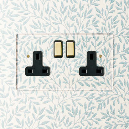 Lucian perspex double socket in clear perspex with black inserts and aged brass switch