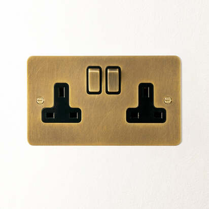 Lucian double socket with black inserts in aged brass