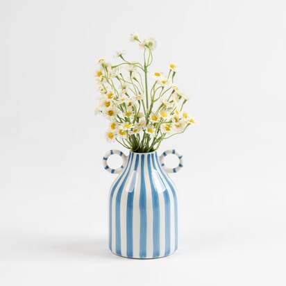 Artificial Daisies in a Ceramic Vase