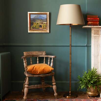 Chukka floor lamp in antiqued brass