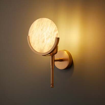 Firefly wall light in antique brass with an alabaster globe