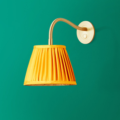 Phoebe flexible wall arm in antique brass