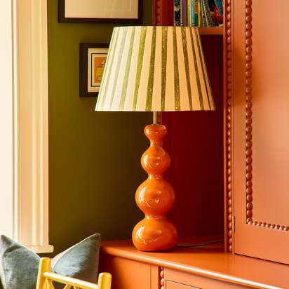 Smaller Wobster table lamp in burnt orange lacquered wood