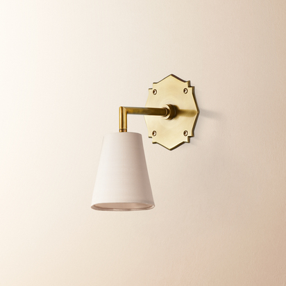 single insignia wall fitting in antique brass