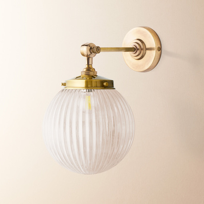 Elbow wall fitting in antiqued brass